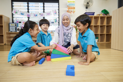 Children engaged in an activity with a teacher