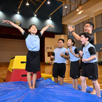 Teacher clapping and cheering for student